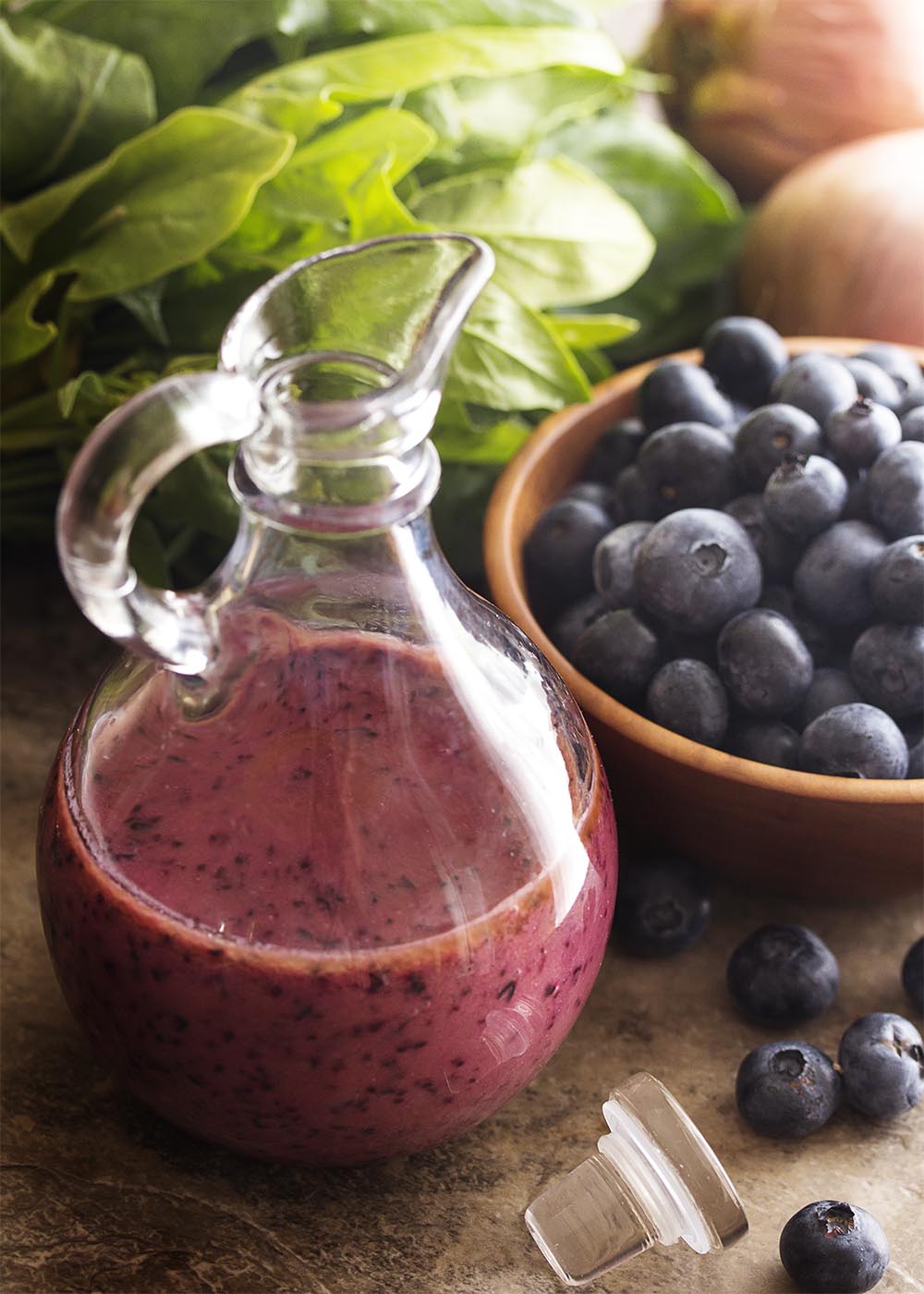 It's time to make a fruity summer salad dressing! Quickly puree up fresh blueberries into a spicy, sweet, and tangy blueberry vinaigrette. | justalittlebitofbacon.com
