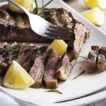Grilled Tuscan steak is a simple, yet elegant Florentine style specialty! Start with a couple of thick-cut, bone-in steaks, add fresh herbs and a hot grill, then finish them off with fruity olive oil and a squeeze of lemon. | justalittlebitofbacon.com