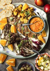 This grilled pork tenderloin peaches and radicchio platter is full of great Spanish flavors and fun additions to make this an excellent meal for a special occasion. Or for next Saturday night! | justalittlebitofbacon.com