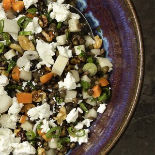 This cold French lentil and kohlrabi salad makes a great summer recipe! The spicy kohlrabi and earthy lentils are tossed with carrots and goat cheese for a tasty weeknight side dish. Healthy, easy, and quick! | justalittlebitofbacon.com
