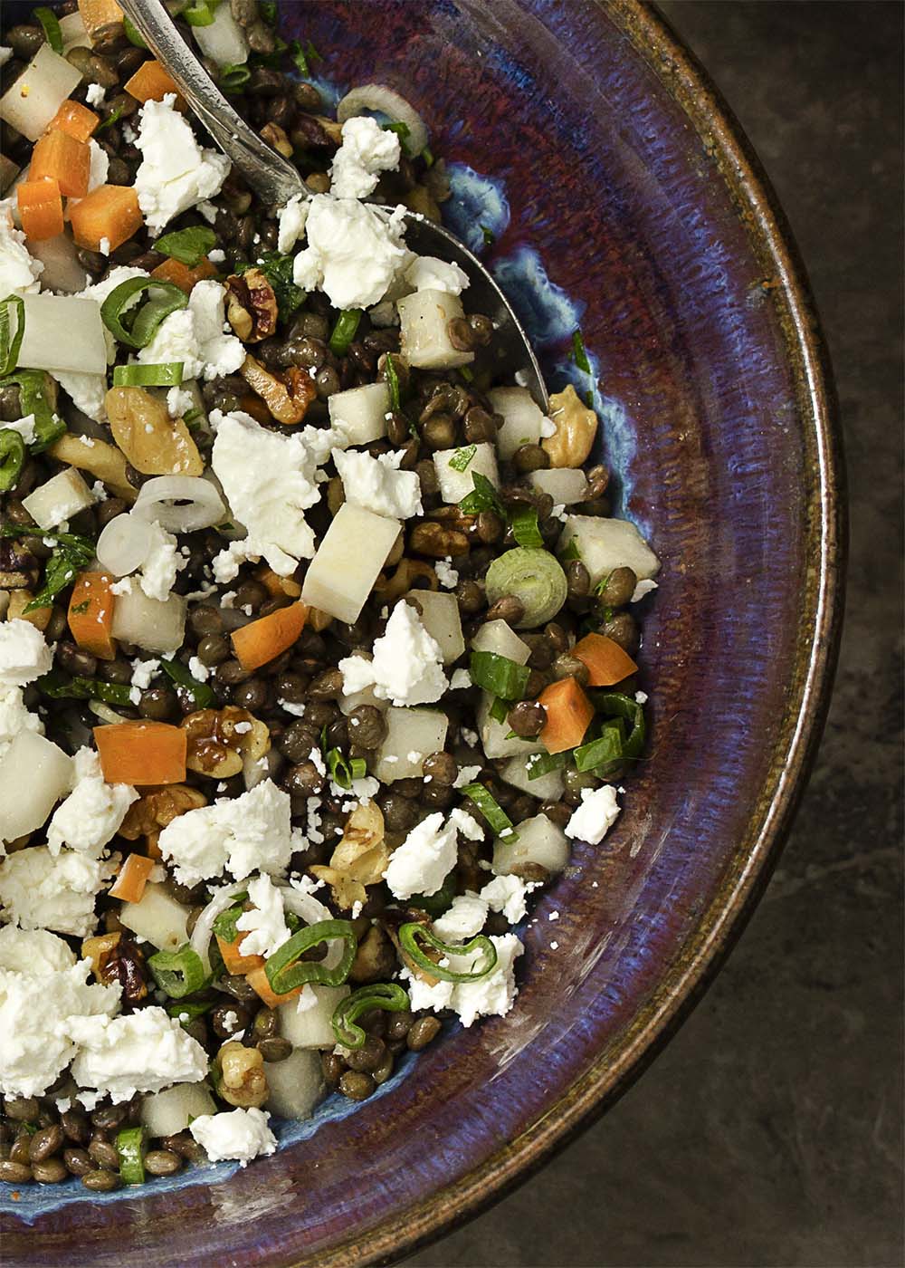 This cold French lentil and kohlrabi salad makes a great summer recipe! The spicy kohlrabi and earthy lentils are tossed with carrots and goat cheese for a tasty weeknight side dish. Healthy, easy, and quick! | justalittlebitofbacon.com