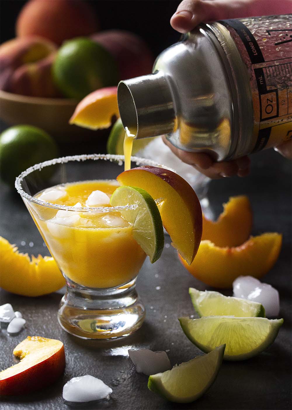Have some overripe peaches on the counter? Puree them up into an intensely peachy and not too sweet fresh peach margarita on the rocks! | justalittlebitofbacon.com
