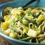 This vegetarian main course is based on a classic dish from Liguria where pesto sauce is paired with pasta, potatoes, and green beans. Easy, one pot meal! | justalittlebitofbacon.com