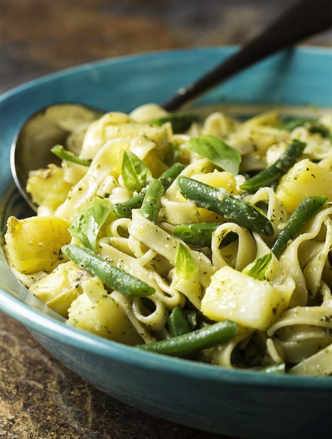 This vegetarian main course is based on a classic dish from Liguria where pesto sauce is paired with pasta, potatoes, and green beans. Easy, one pot meal! | justalittlebitofbacon.com