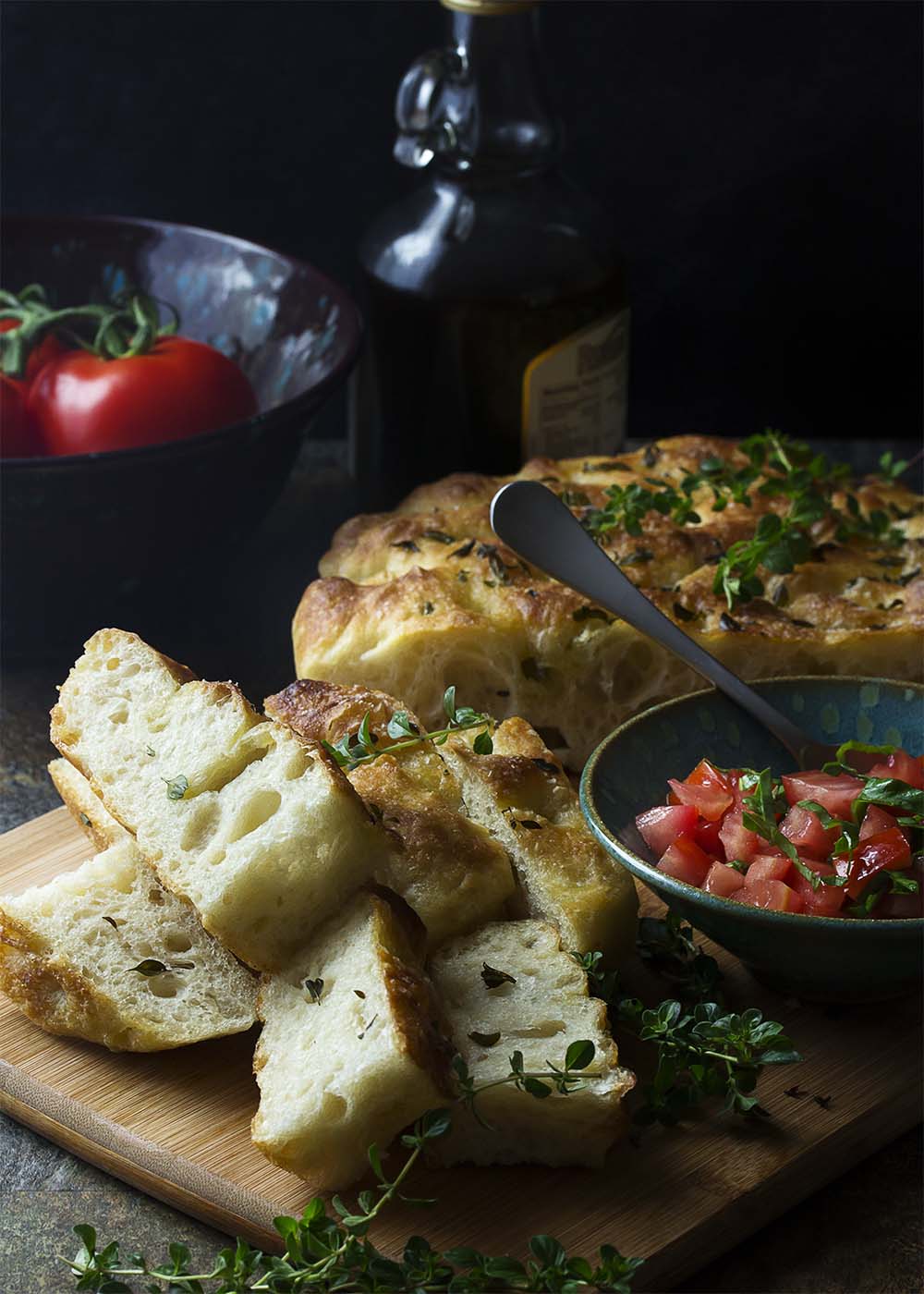 My no-knead focaccia bread with garlic and thyme is made right in a cast iron skillet, giving it a soft and chewy interior and crispy edges. Easy! Great for dinner or for paninis! | justalittlebitofbacon.com