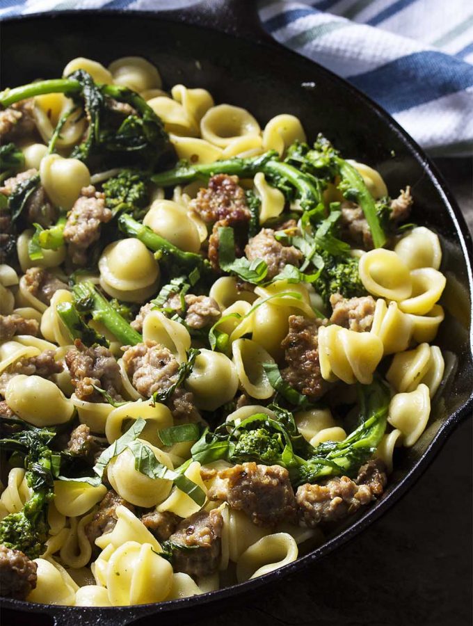 For a healthy and easy weeknight dinner this Italian recipe for orecchiette pasta, broccoli rabe, and sausage delivers flavor and gets dinner on the table fast. | justalittlebitofbacon.com