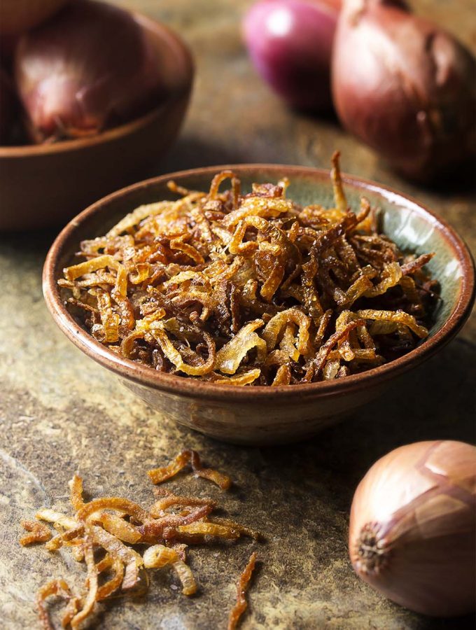 Making crispy fried shallots is a simple and easy process! All you need are three ingredients and a little time to get them golden brown. Gluten-free. Vegan. | justalittlebitofbacon.com