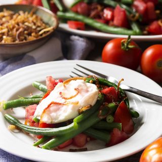Creamy burrata, crispy shallots and ripe tomatoes along with fresh green beans give my Italian green bean salad plenty of flavor and balance. Add in a homemade Italian dressing and you'll want to make this salad every week! | justalittlebitofbacon.com
