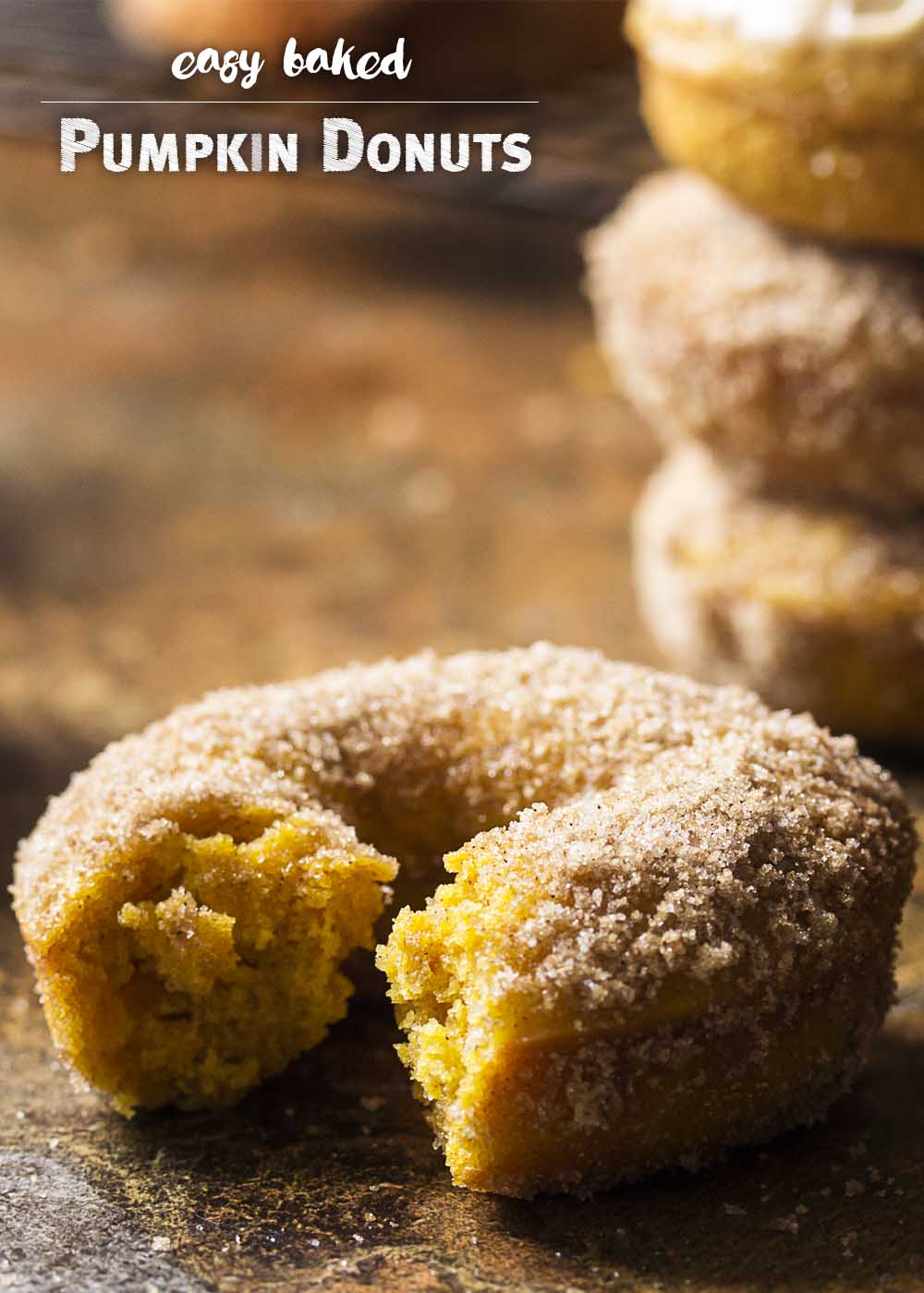 These easy and tasty baked pumpkin donuts are full of pumpkin puree and warming spices for a great fall breakfast or dessert. Either top them with a maple butterscotch glaze or roll them in cinnamon sugar. | justalittlebitofbacon.com