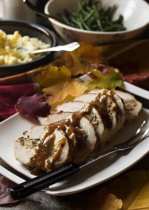 My fig and sausage stuffed turkey breast roulade makes an impressive main course which is perfect for Thanksgiving or Christmas holiday dinner. And while it rests you can make a white wine gravy from the drippings!