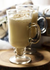 Homemade hot bourbon eggnog is easy to make and will warm you right through. I think it's the perfect drink for cold and snowy days by the fire! | justalittlebitofbacon.com