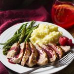 Pan seared duck breast cooked until the skin is golden brown and crispy and then topped with a sweet and spicy make ahead sauce of red wine, port, raspberries, and a little bit of honey. Great for date night, dinner parties, or a romantic Valentine's day meal.