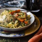My quick French chicken fricassee is comfort food for a weeknight dinner. Boneless, skinless chicken thighs are braised along with root vegetables in white wine and then finished with a bit of cream and egg yolks to make a smooth and silky sauce. | justalittlebitofbacon.com
