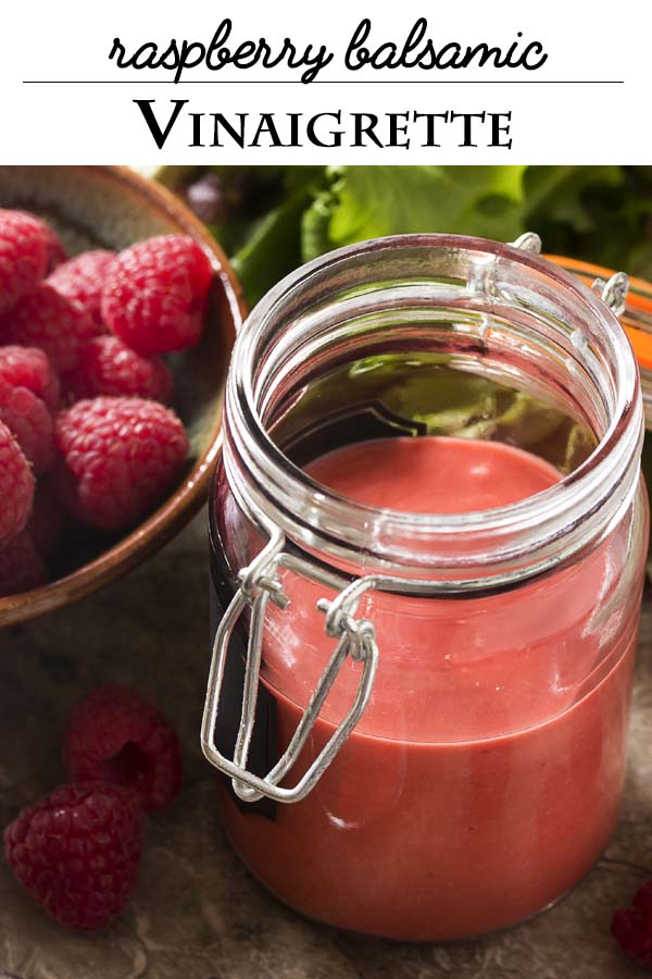 Put down the bottled salad dressing and jazz up your salads with a fresh raspberry balsamic vinaigrette! It's simple to make. Just a few minutes and a blender and you'll have a thick, sweet and spicy dressing for salads, chicken, salmon, and more. | justalittlebitofbacon.com #salads #saladdressing #vinaigrette #saladrecipes #raspberries #raspberryvinaigrette
