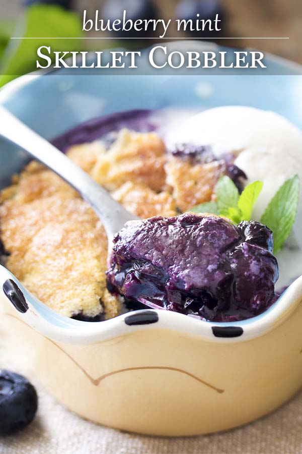 Fresh and easy, this homemade blueberry skillet cobbler is flavored with mint, cinnamon, and maple syrup and cooked right in your cast iron pan. Great for breakfast or dessert with a scoop of vanilla ice cream. | justalittlebitofbacon.com #dessertrecipes #blueberries #summerrecipes #cobbler #blueberrycobbler #castiron