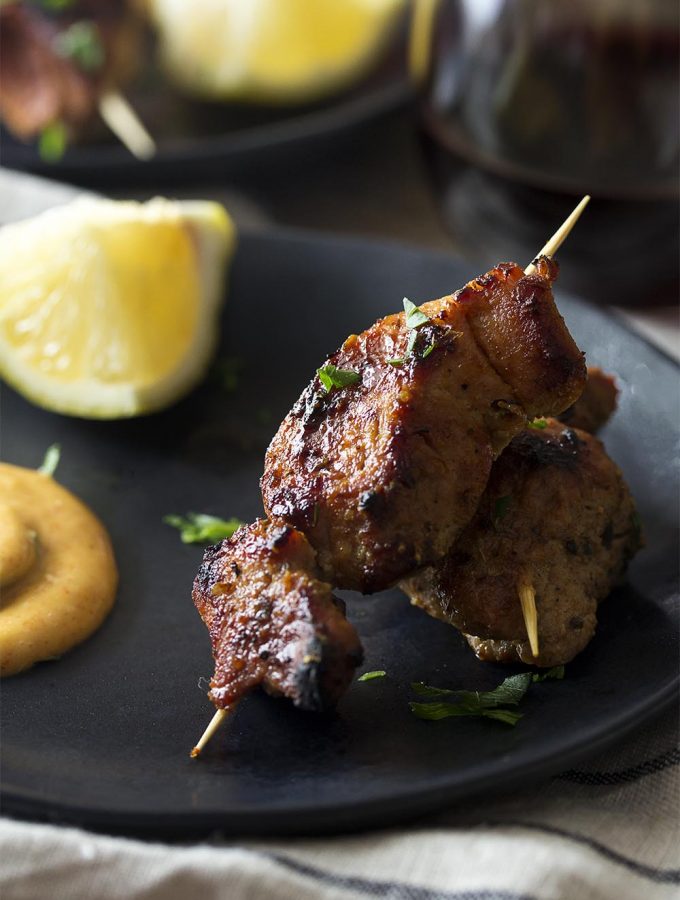 Pinchos morunos are a delicious Spanish tapas. These little pork kebabs are marinated and grilled then served with a paprika aioli sauce for a great summer appetizer.