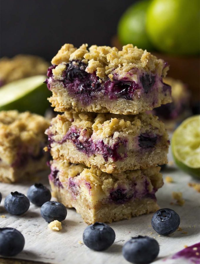 Fresh blueberry oatmeal bars are paired with key lime pie filling and a simple crumble to make the crust and topping. These are a great summer treat! Perfect for parties and bbqs.