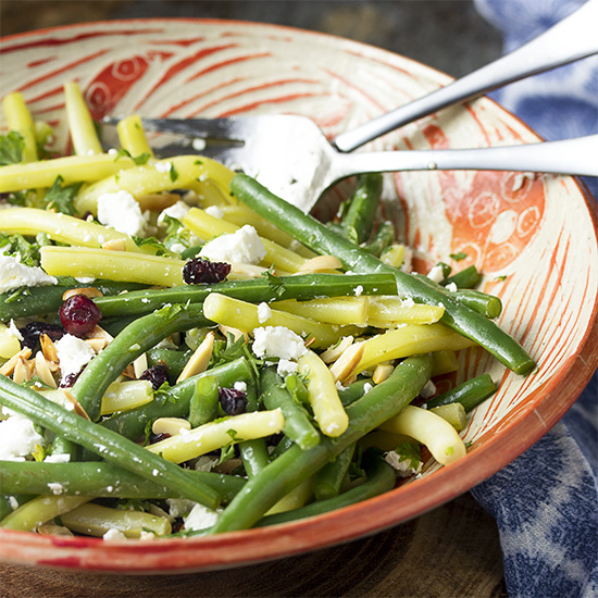 This fresh green bean almond salad with goat cheese and dried cranberries is tossed with a simple vinaigrette. It's the perfect salad for any night. Great for summer parties, weeknight dinners, holidays like Thanksgiving and Christmas.