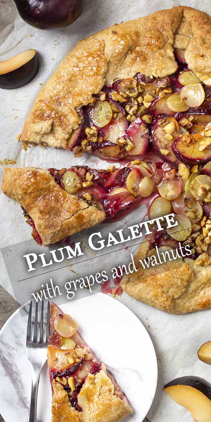 Ripe sliced plums, crisp grapes, and toasted walnuts are wrapped in a simple, flaky pie crust and brushed with honey in this rustic French plum galette tart. | justalittlebitofbacon.com #frenchrecipes #mediterraneanrecipes #pierecipes #tartrecipes #galette #crostata #plums