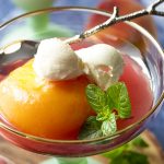 The flavors of cinnamon, cardamom, and allspice infuse these Moscato wine and honey poached peaches, creating a simple and elegant summer dessert. Serve the peaches with their spiced syrup over cake, with ice cream, or with a dollop of mascarpone. | justalittlebitofbacon.com #italianrecipe #summerrecipe #peaches #dessertrecipe