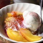 Crisp on the outside and tender inside, toasted pound cake makes a great dessert when topped with poached peaches, spiced syrup, and a scoop of ice cream. | justalittlebitofbacon.com #poundcake #dessertrecipe #peaches #cooking #recipes