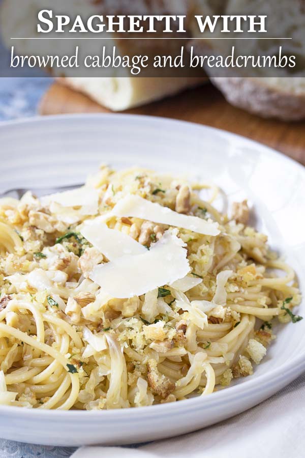 Pasta in a wide bowl with text overlay - Spaghetti with Cabbage and Breadcrumbs.