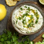 Fast and flavorful! This Italian-style Tuscan white bean dip is full of fresh thyme, garlic, and lemon zest and uses canned beans to make an easy and healthy party dip. | justalittlebitofbacon.com #veganrecipe #glutenfreerecipe #beandip #appetizers #dips #holidayrecipe #italianrecipe