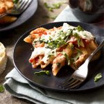 For classic, cheesy Italian comfort food, you'll love this simple recipe for vegetarian baked penne! It's full of marinara sauce, mozzarella, and tender pasta. Mix it up by using rigatoni or ziti in place of the penne! | justalittlebitofbacon.com #italianrecipes #pastarecipes #bakedpenne #bakedziti #pasta #italian