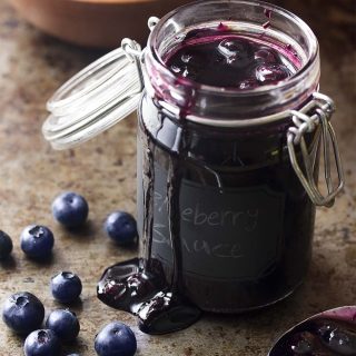 It's easy to make fresh and homemade blueberry sauce! A few minutes of cooking and you'll be spooning this fruit compote over pound cake, cheesecake, pancakes, ice cream, and more. | justalittlebitofbacon.com #blueberries #fruitsauce #berries #cheesecake #pancakes