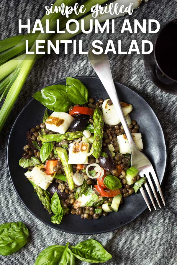 Halloumi lentil salad on a black plate with text overlay - Halloumi and Lentil Salad.