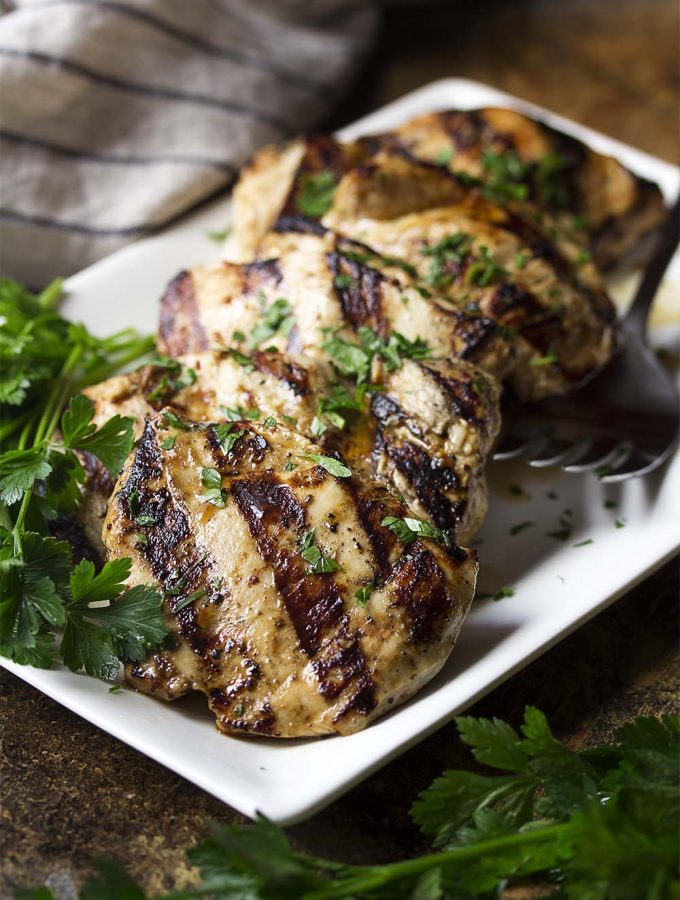 Grilled balsamic chicken is a simple and flavorful Italian-themed meal! Chicken breast or thighs are quickly marinated in a balsamic vinaigrette and then given a turn on the grill for juicy, tender meat. | justalittlebitofbacon.com #grilledchicken #chickenrecipes #chickenbreast #chickenthighs #grillingrecipes #italianrecipes
