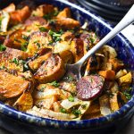 You'll love this ultimate one pot meal whether you call it chorizo or chourico! My Portuguese chorizo and sweet potato bake with onions and parsley is both delicious and simple to make. Just toss everything together and bake until the edges are crispy and potatoes are tender. | justalittlebitofbacon.com #portugeserecipes #spanishrecipes #chorizo #chourico #onepotmeals #easydinners