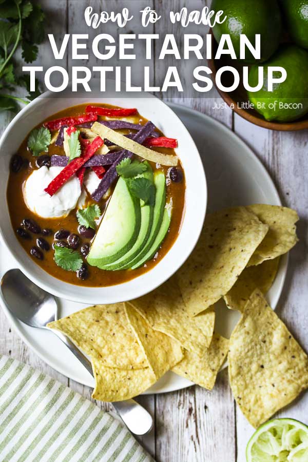Soup in white bowl with chips and text overlay - Vegetarian Tortilla Soup.