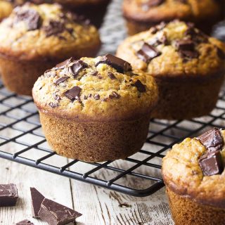 You'll love these simple and moist chocolate chip banana oat muffins! Perfect for a quick breakfast or a tasty snack on the go and they freeze well too! | justalittlebitofbacon.com #muffins #breakfast #bananas #muffinrecipes #breakfastrecipes #baking