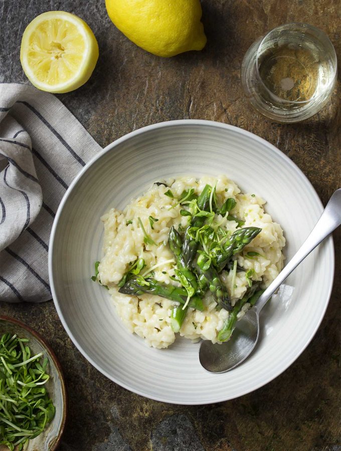 You'll love this simple asparagus risotto full of bright lemon and creamy brie! Make it on the stove top or in an Instant Pot for an easy dinner tonight. | justalittlebitofbacon.com #italianfood #risotto #asparagusrecipes #asparagus #springrecipes #easydinners