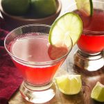 Learn how to make a cosmopolitan martini, a classic drink which is both easy and delicious! Four ingredients (including cranberry juice and vodka) are all you need to be sipping this fun pink cocktail right now. | justalittlebitofbacon.com #cocktailrecipes #drinkrecipes #cosmopolitan #vodkacocktails #martinis #cranberryjuice