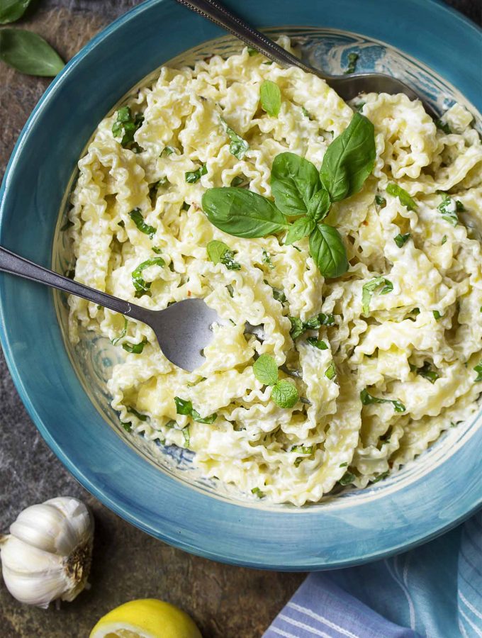 For a quick weeknight meal try my creamy lemon ricotta pasta! This simple cheese sauce mixed with fresh basil and mint will have dinner on the table in minutes. | justalittlebitofbacon.com #pastarecipes #italianfood #easydinners #italian #ricotta