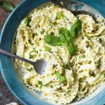 For a quick weeknight meal try my creamy lemon ricotta pasta! This simple cheese sauce mixed with fresh basil and mint will have dinner on the table in minutes. | justalittlebitofbacon.com #pastarecipes #italianfood #easydinners #italian #ricotta