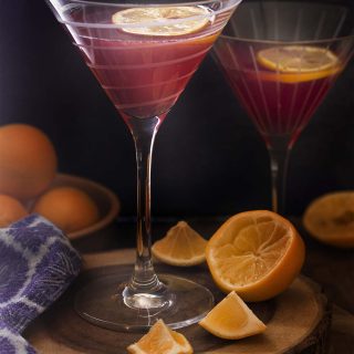 For a fun cosmo drink twist try this meyer lemon cosmopolitan cocktail! Great flavor, easy to make, and just a few ingredients. Make a glass or a pitcher. | justalittlebitofbacon.com #cocktailrecipes #cosmopolitan #drinkrecipes #cocktails #drinks #meyerlemons