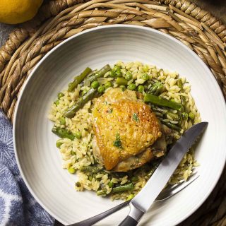 Use only a skillet in my one pot chicken and orzo dinner! Juicy thighs, pasta, and plenty of vegetables in this easy, weeknight meal. | justalittlebitofbacon.com