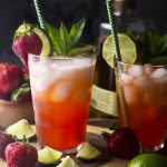For a summertime twist on a classic cocktail try my strawberry mojitos! Lime, mint, rum, fresh fruit, and sparkling water make an easy drink perfect for hot weather. | justalittlebitofbacon.com