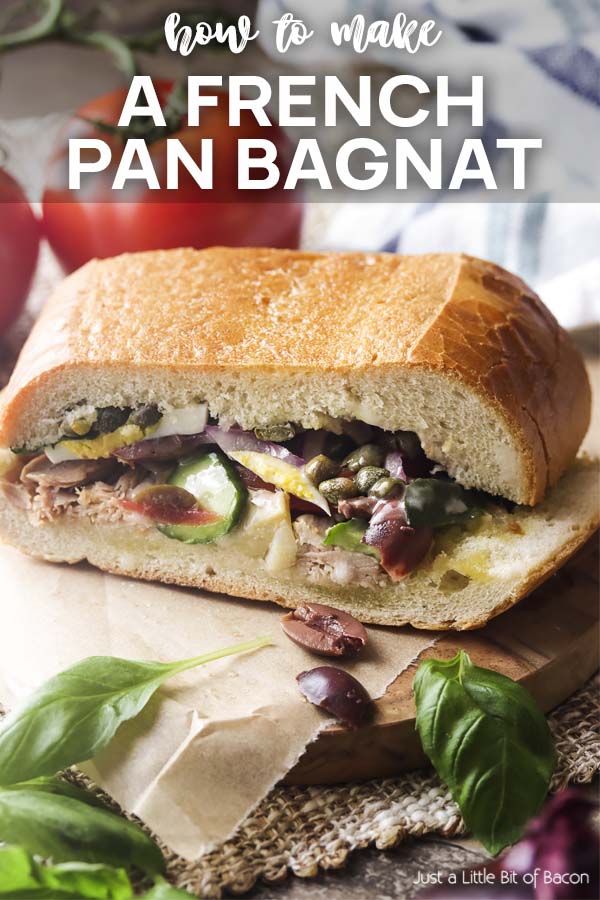 Closeup of a slice of baguette sandwich with text overlay - How to Make a French Pan Bagnat.
