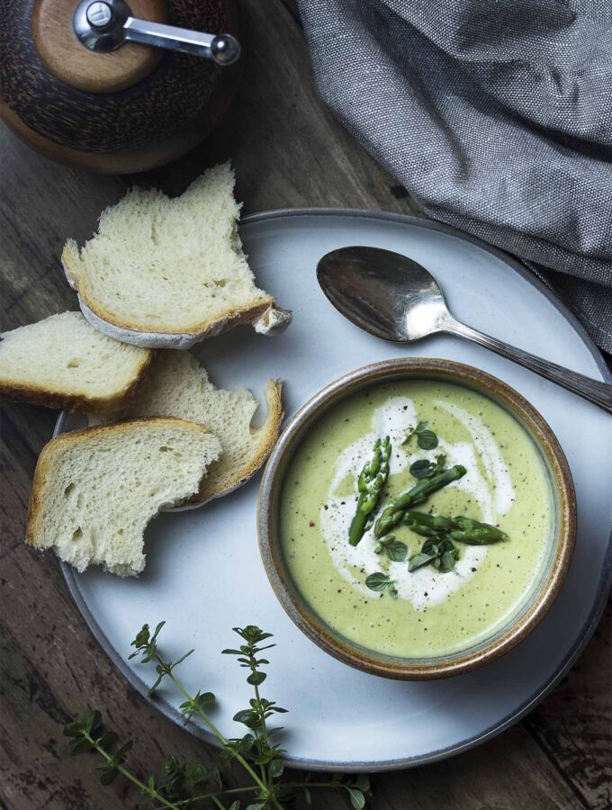 Smooth and creamy cold asparagus bisque is a recipe you'll want to make all year long! This classic French soup is easy to make, takes only a handful of ingredients, and comes together quickly. Perfect as a first course or as a vegetarian main. | justalittlebitofbacon.com